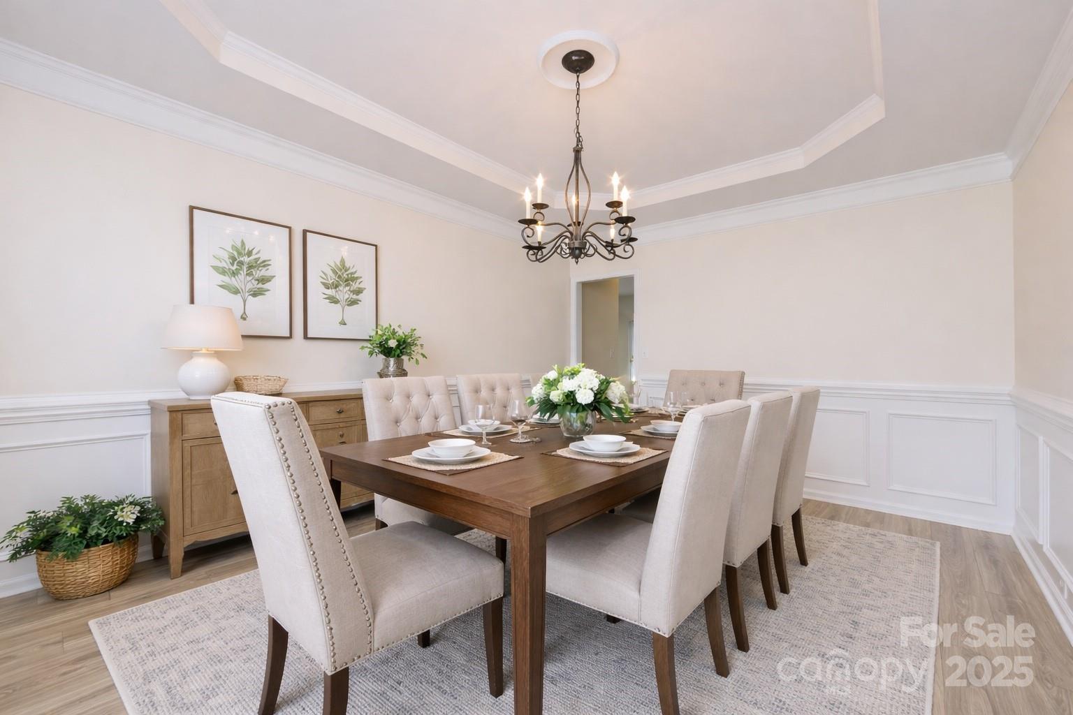 2705 Gosling Terrace Road Charlotte, NC 28262 - Photo 21 of 25 a dining room with furniture potted plants and a chandelier