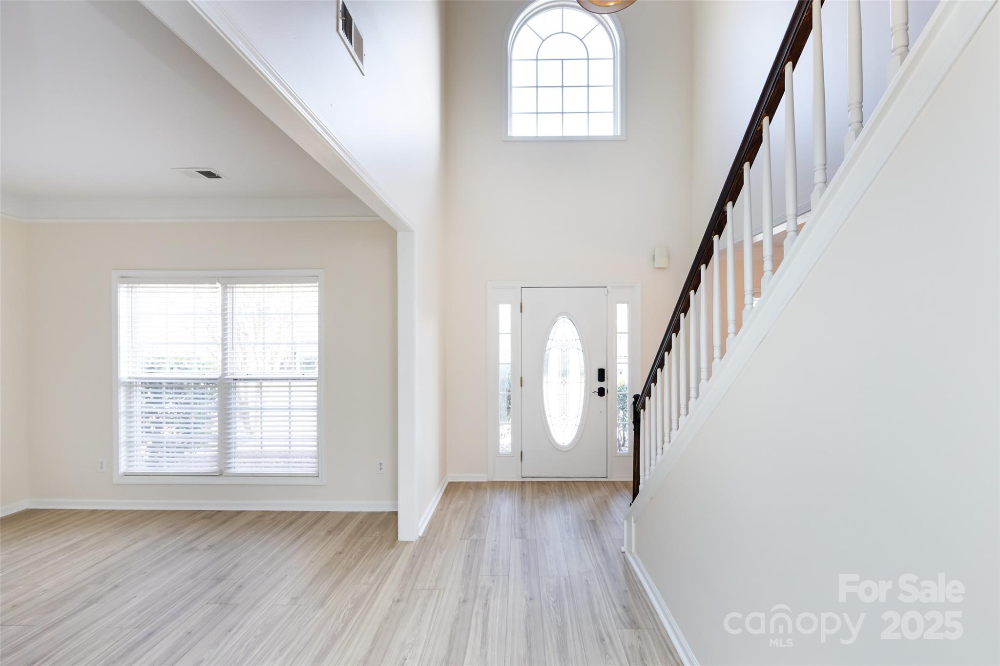 2705 Gosling Terrace Road Charlotte, NC 28262 - Photo 9 of 25 a view of staircase with wooden floor and staircase