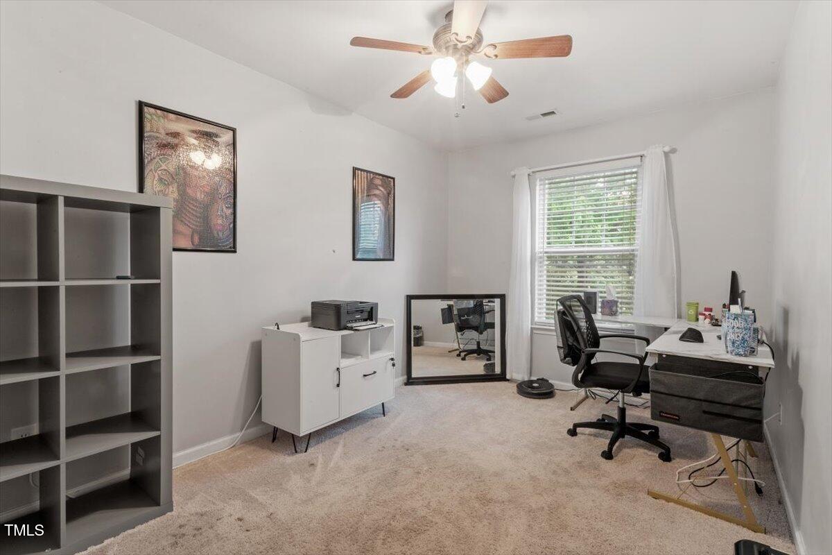 300 Gilman Lane, Unit 101 Raleigh, NC 27610 - Photo 16 of 25 a work room with furniture and window