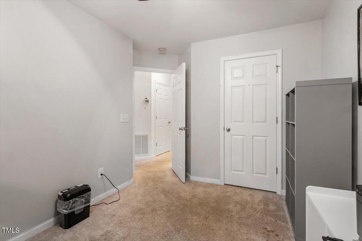 300 Gilman Lane, Unit 101 Raleigh, NC 27610 - Photo 17 of 25 a view of a storage & utility room with a sink