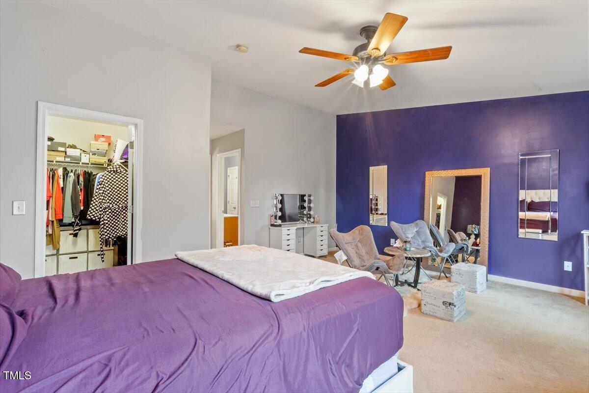 300 Gilman Lane, Unit 101 Raleigh, NC 27610 - Photo 25 of 25 a bed room with a bed and a chair