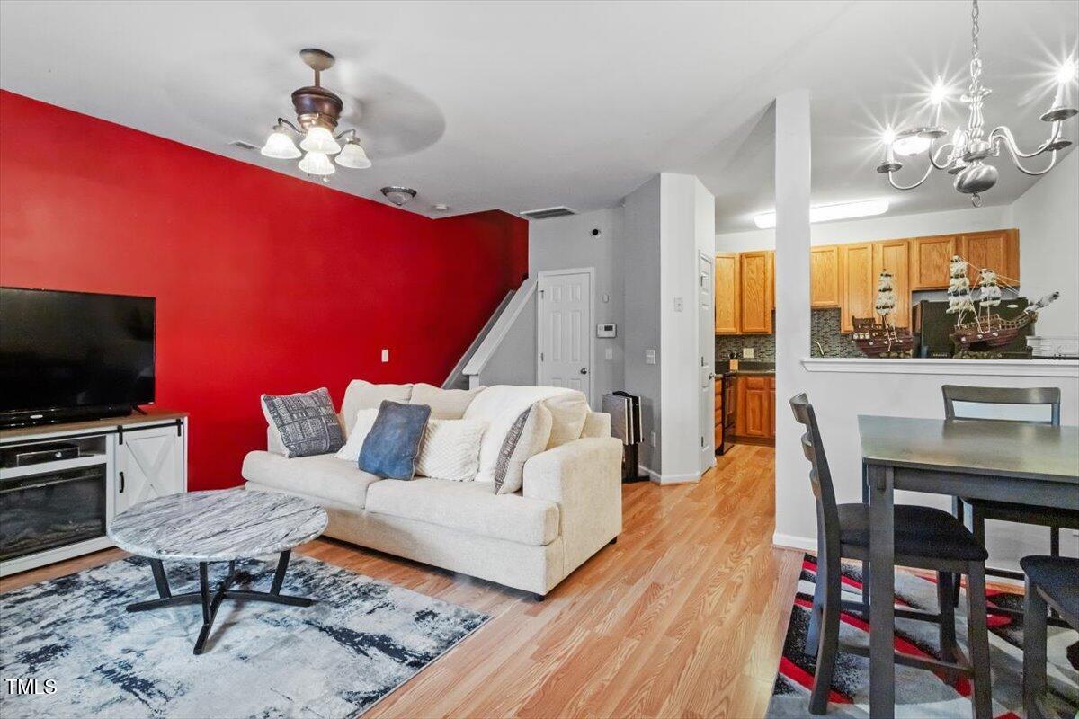 300 Gilman Lane, Unit 101 Raleigh, NC 27610 - Photo 4 of 25 a living room with furniture and a flat screen tv