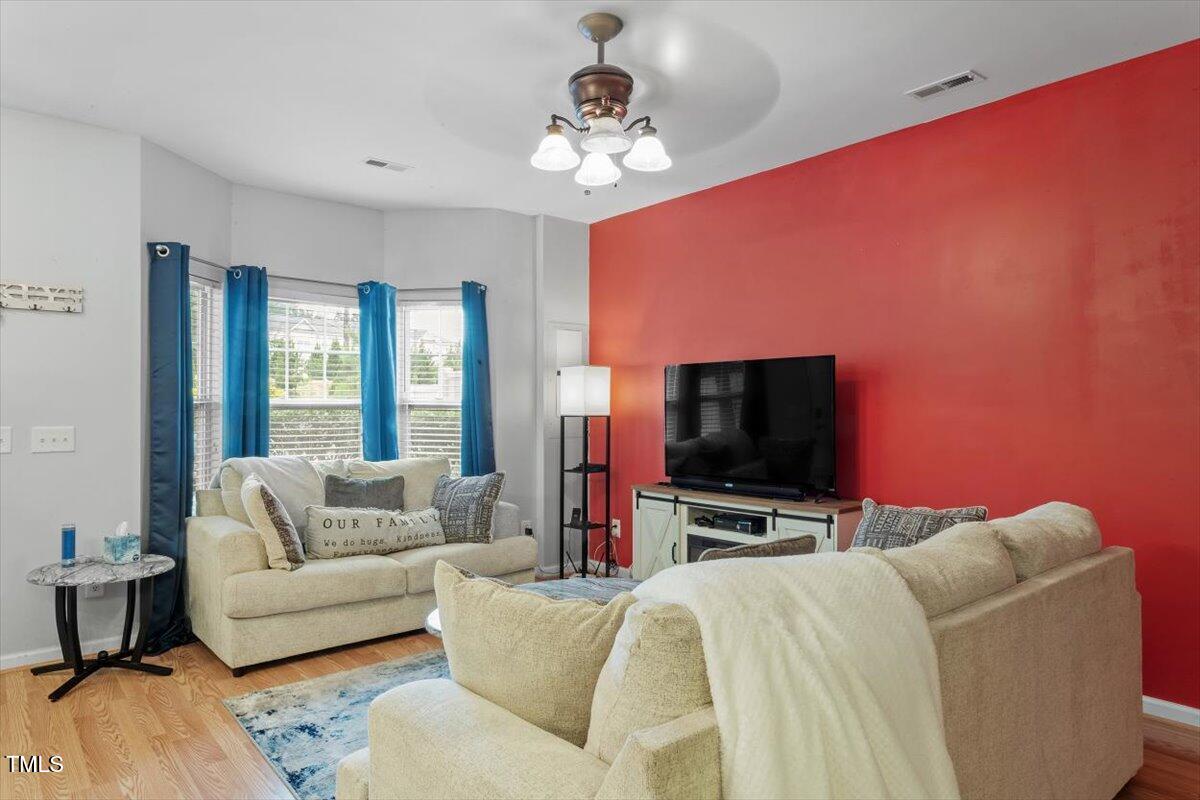 300 Gilman Lane, Unit 101 Raleigh, NC 27610 - Photo 6 of 25 a living room with furniture and a flat screen tv