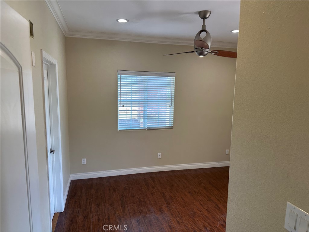 719 East Harvard Road Burbank, CA 91501 - Photo 14 of 23 a view of an empty room with wooden floor and a window