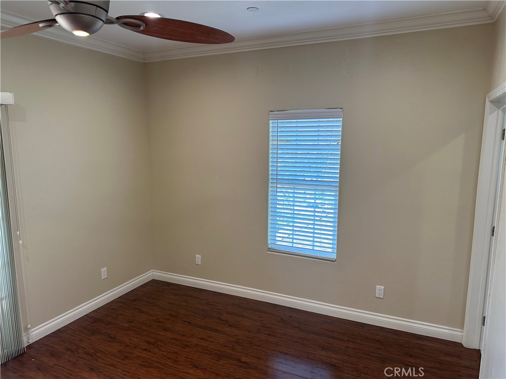 719 East Harvard Road Burbank, CA 91501 - Photo 19 of 23 a view of an empty room with wooden floor and a window