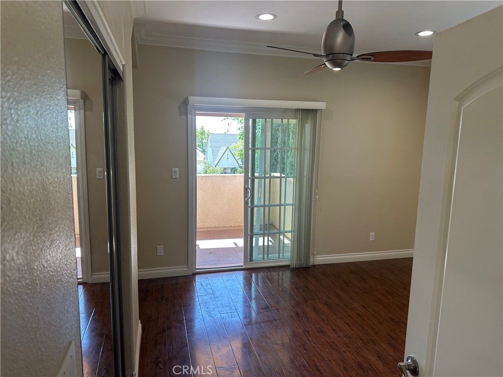 719 East Harvard Road Burbank, CA 91501 - Photo 22 of 23 a view of an empty room with wooden floor and a window