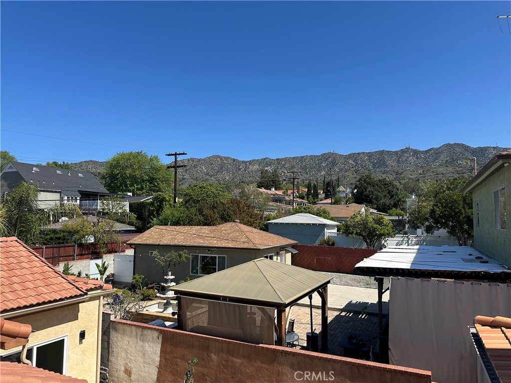 719 East Harvard Road Burbank, CA 91501 - Photo 5 of 23 a view of a patio with swimming pool and mountain view