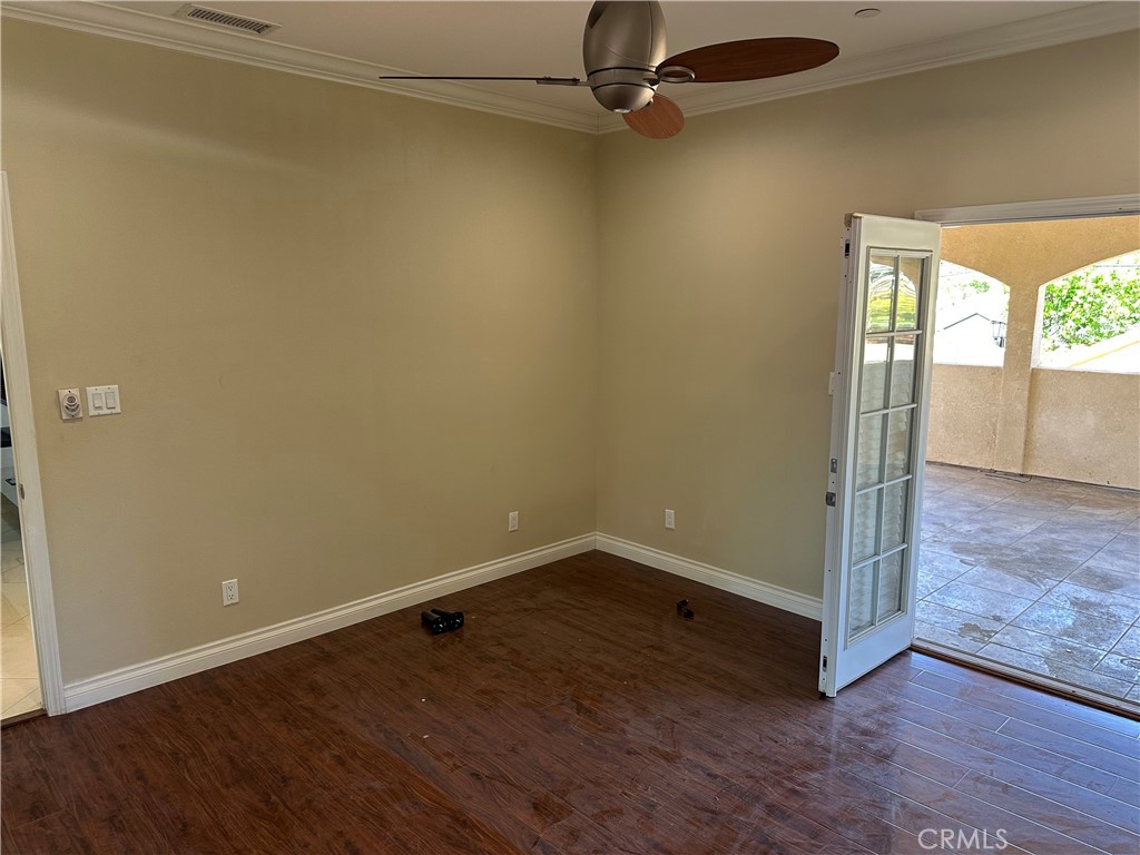 719 East Harvard Road Burbank, CA 91501 - Photo 10 of 23 an empty room with wooden floor and windows