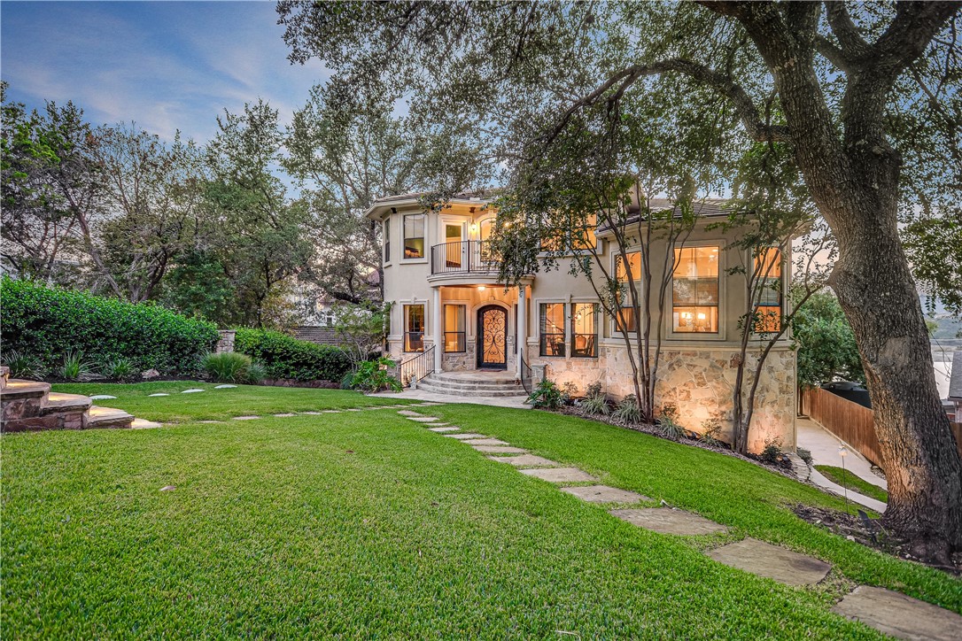 8136 Joy Road Volente, TX 78641 - Photo 1 of 1 a view of an house with backyard space and garden