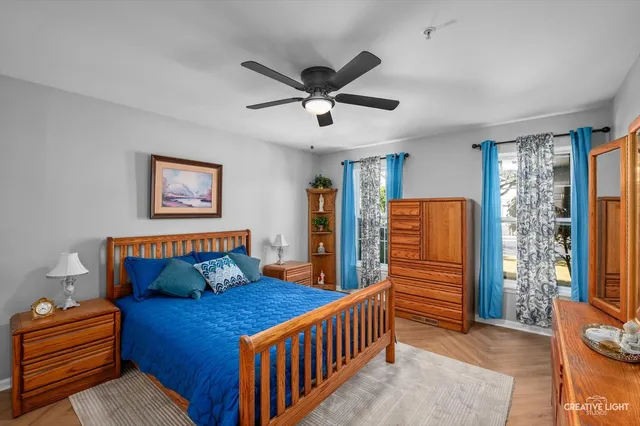 a bedroom with furniture and a window