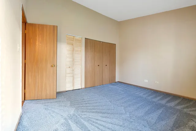 an empty room with closet area