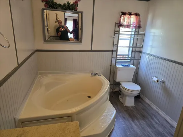 a white toilet sitting next to a bathroom sink