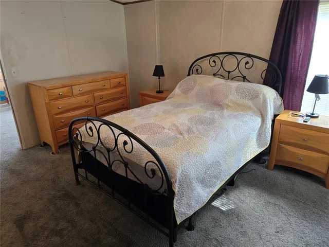 a bedroom with a bed in it