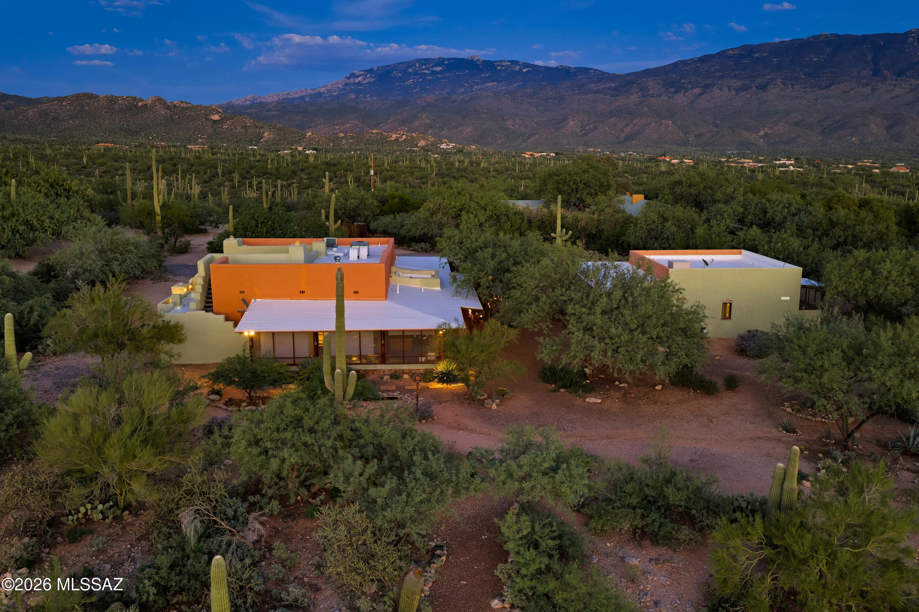 13013 East Redington Road Tucson, AZ 85749 - Photo 5 of 51 Up-close mountain views of the nearby Catalina and Rincon Mountain Ranges, this charming property is comprised of a main house, a guest house, and storage sheds that provide 952 sq. ft. of additional space.