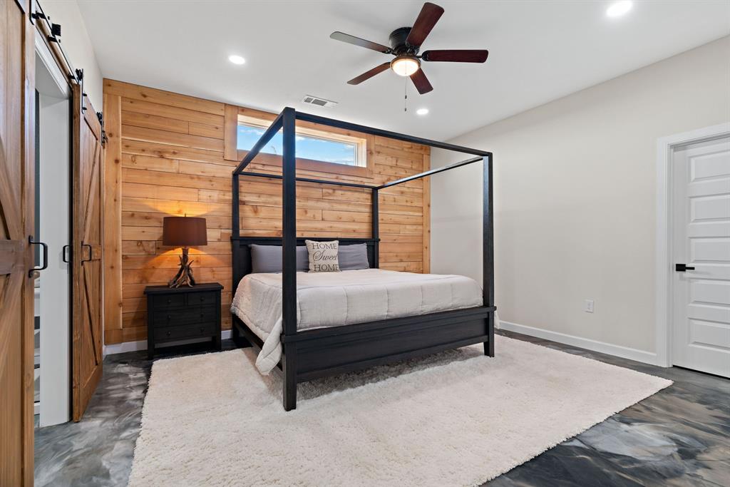 5410 Buffalo Ridge Drive, Unit L Stephenville, TX 76401 - Photo 14 of 40 a bedroom with a bed and a window