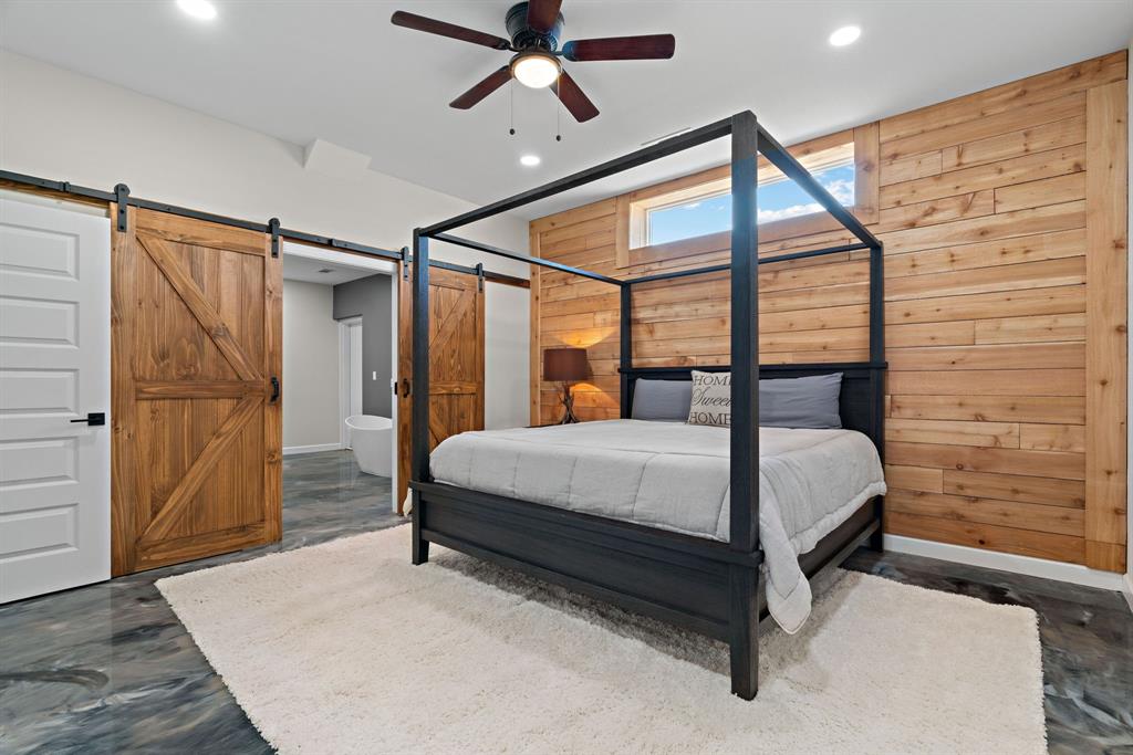 5410 Buffalo Ridge Drive, Unit L Stephenville, TX 76401 - Photo 15 of 40 a bed sitting in a bedroom next to a window