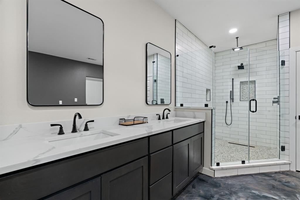 5410 Buffalo Ridge Drive, Unit L Stephenville, TX 76401 - Photo 16 of 40 a bathroom with a double vanity sink mirror and double