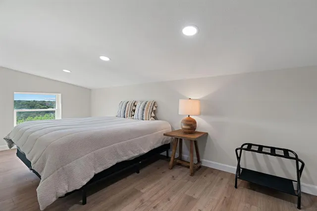 a bathroom with a sink toilet vanity and shower
