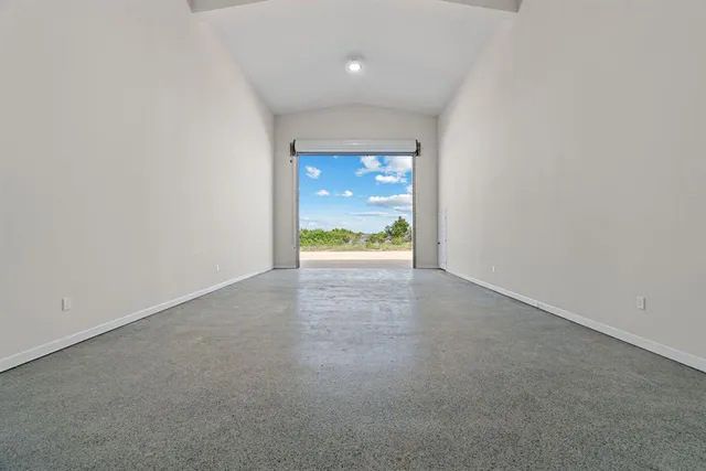 a view of a road with a big yard