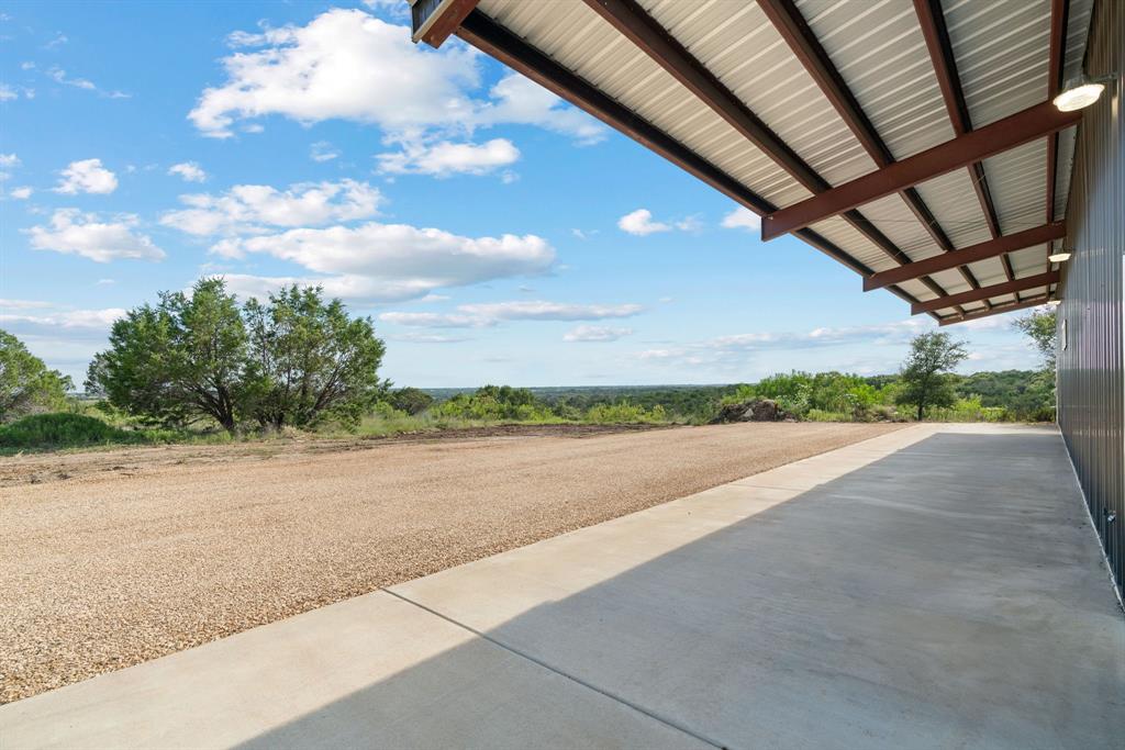 5410 Buffalo Ridge Drive, Unit L Stephenville, TX 76401 - Photo 26 of 40 a view of a road with a big yard