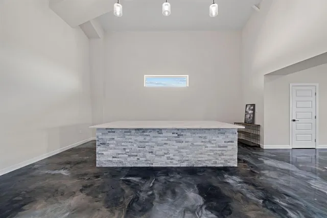 a view of room with wooden floor