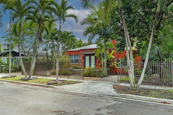 a view of a backyard with sitting area