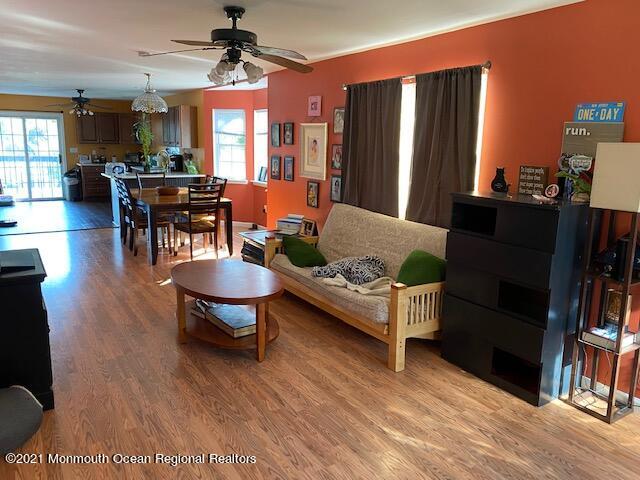 65 9th Street Belford, NJ 07718 - Photo 4 of 10 a living room with furniture and wooden floor