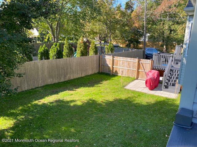65 9th Street Belford, NJ 07718 - Photo 8 of 10 a view of a backyard with a small cabin