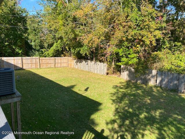 65 9th Street Belford, NJ 07718 - Photo 9 of 10 a view of yard with large trees