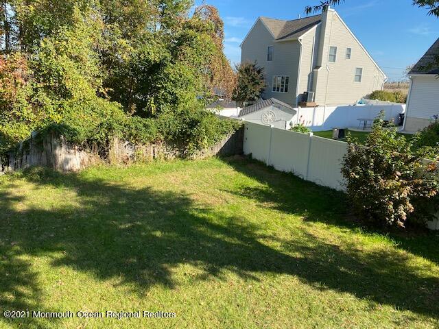 65 9th Street Belford, NJ 07718 - Photo 10 of 10 a view of a house with a yard
