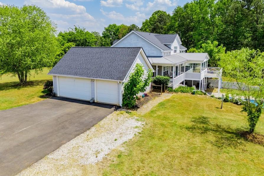 575 Liberty Church Road Carrollton, GA 30116 - Photo 10 of 95 a aerial view of a house with a yard and garage