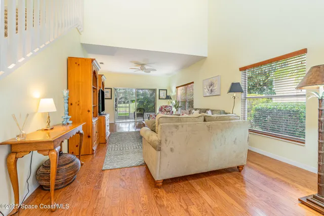 a view of a livingroom with furniture and a flat screen tv