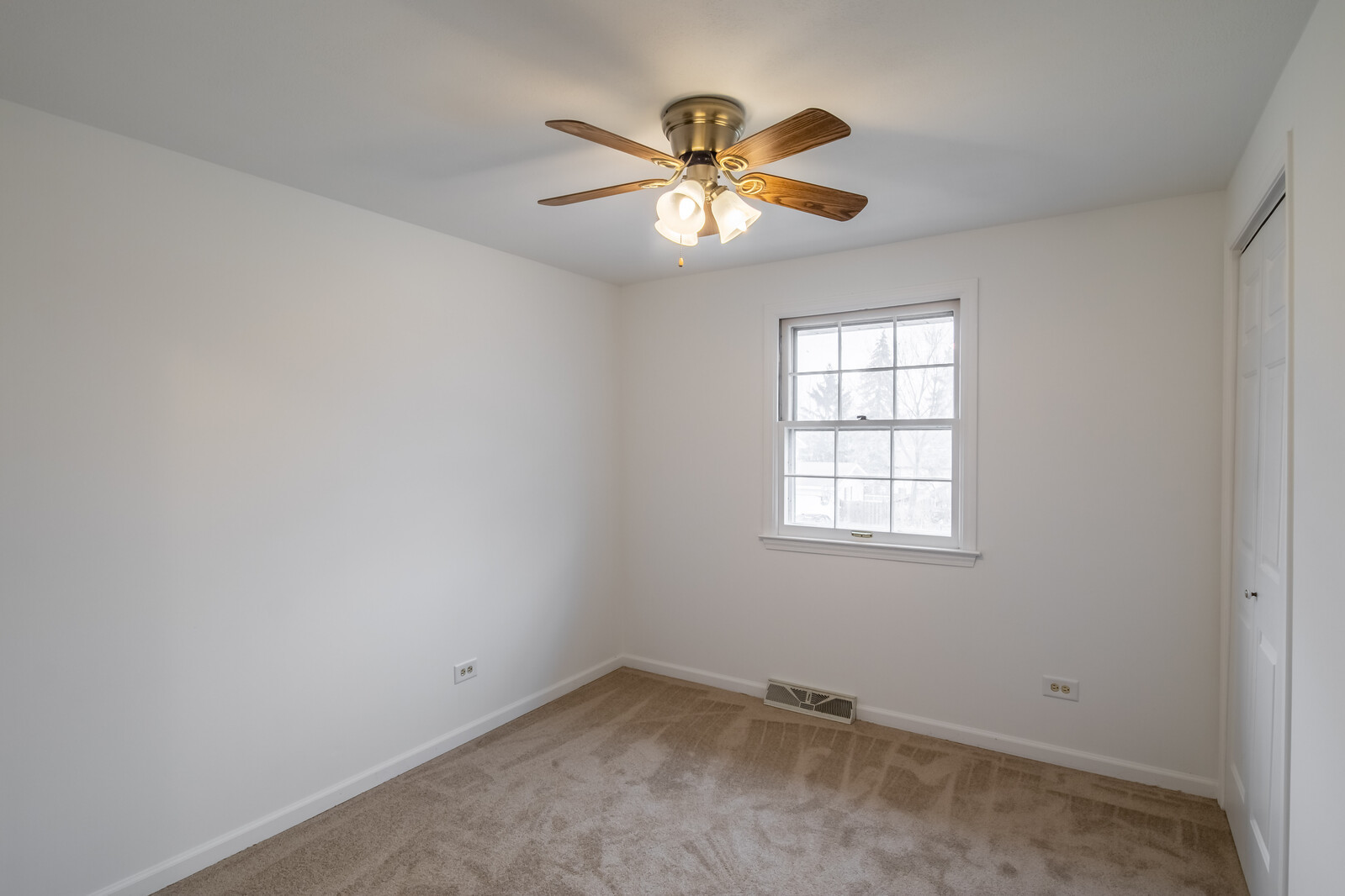 2321 Beck Road Lindenhurst, IL 60046 - Photo 11 of 30 an empty room with a window and a fan