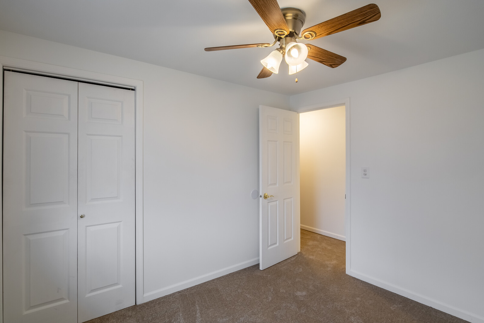 2321 Beck Road Lindenhurst, IL 60046 - Photo 12 of 30 an empty room with closet and a chandelier fan
