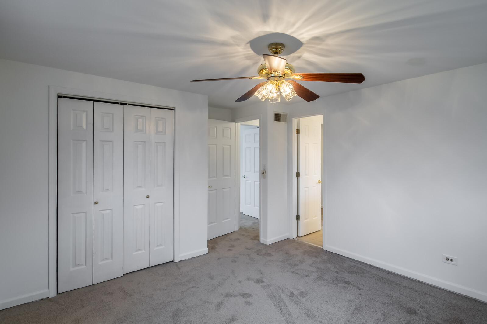 2321 Beck Road Lindenhurst, IL 60046 - Photo 19 of 30 an empty room with a chandelier fan and a chandelier fan