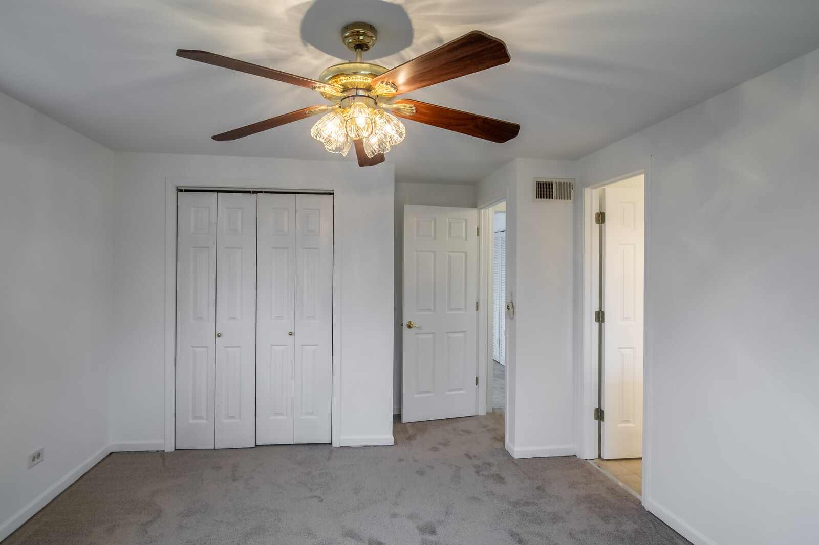 2321 Beck Road Lindenhurst, IL 60046 - Photo 20 of 30 an empty room with a chandelier fan and a chandelier fan