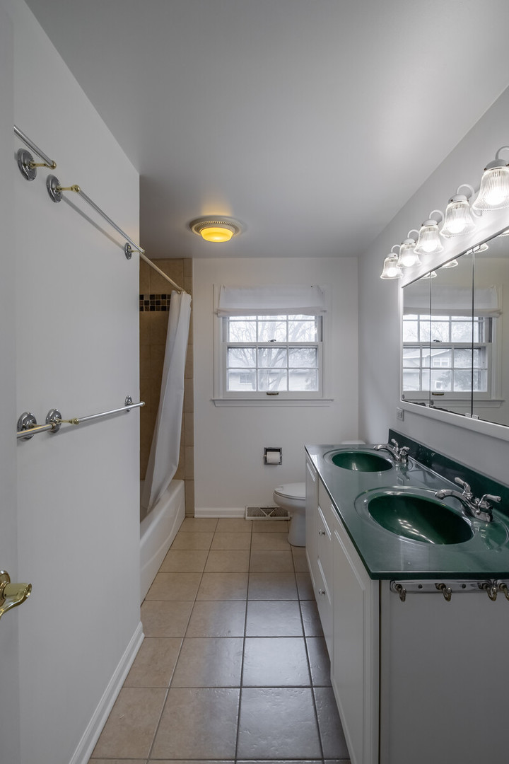 2321 Beck Road Lindenhurst, IL 60046 - Photo 22 of 30 a kitchen with a sink cabinets and window
