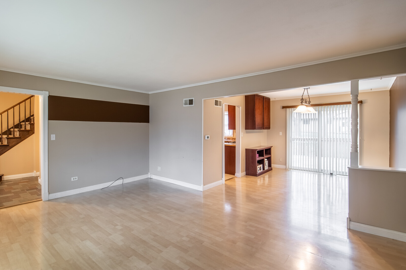 2321 Beck Road Lindenhurst, IL 60046 - Photo 4 of 30 a view of empty room with wooden floor and fireplace