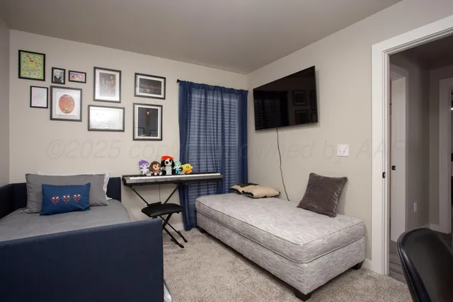 a bedroom with a bed and a couch