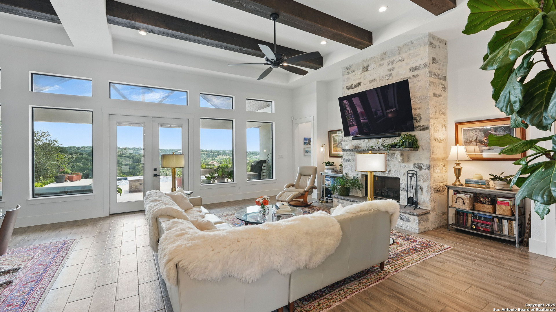 191 Crane Circle Spring Branch, TX 78070 - Photo 12 of 59 a living room with fireplace furniture and a flat screen tv