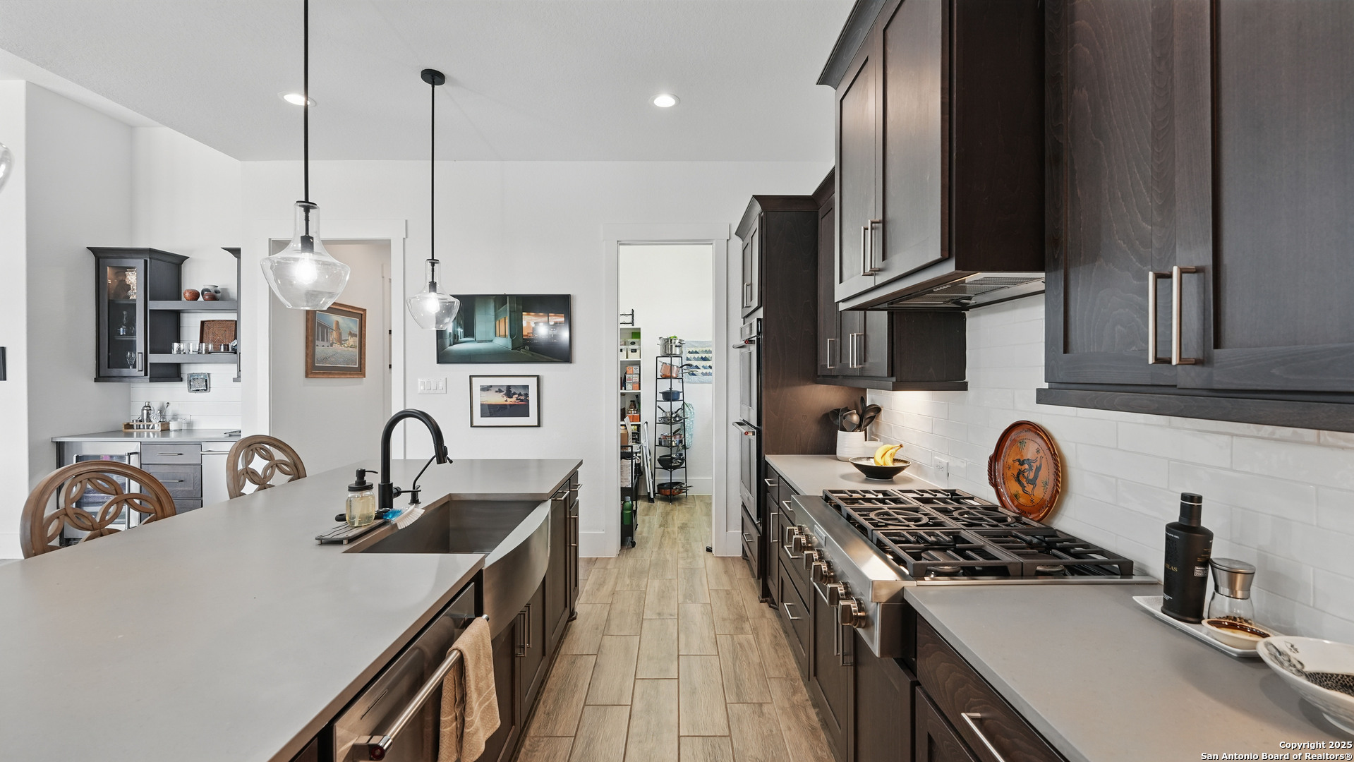 191 Crane Circle Spring Branch, TX 78070 - Photo 18 of 59 a kitchen with stainless steel appliances a sink stove and refrigerator