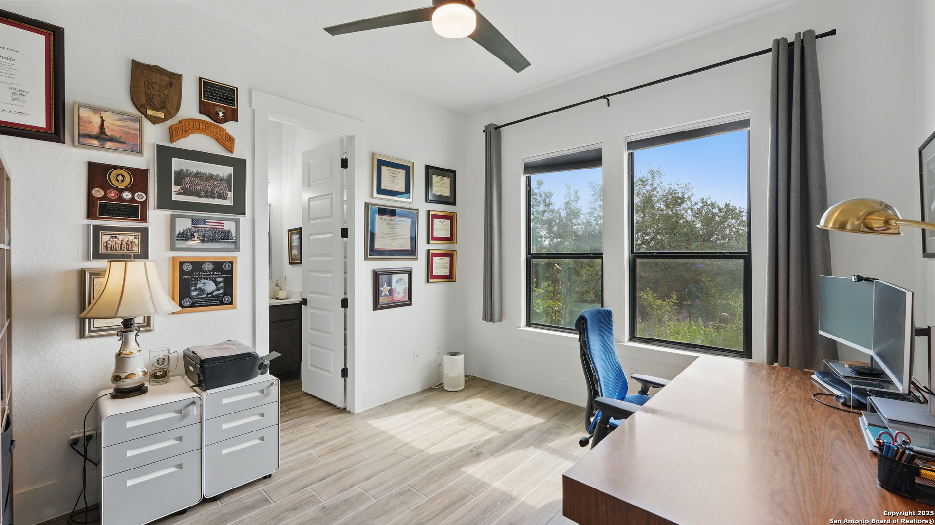 191 Crane Circle Spring Branch, TX 78070 - Photo 21 of 59 a view of a workspace with furniture and a window
