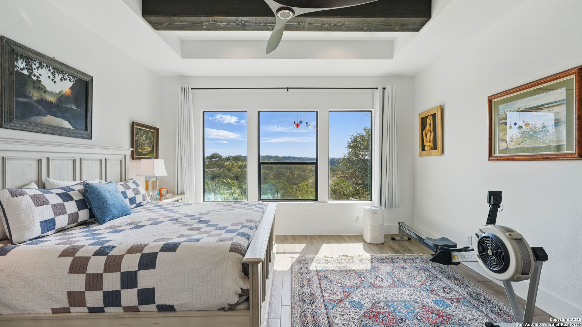 191 Crane Circle Spring Branch, TX 78070 - Photo 22 of 57 a bedroom with a bed and wooden floor