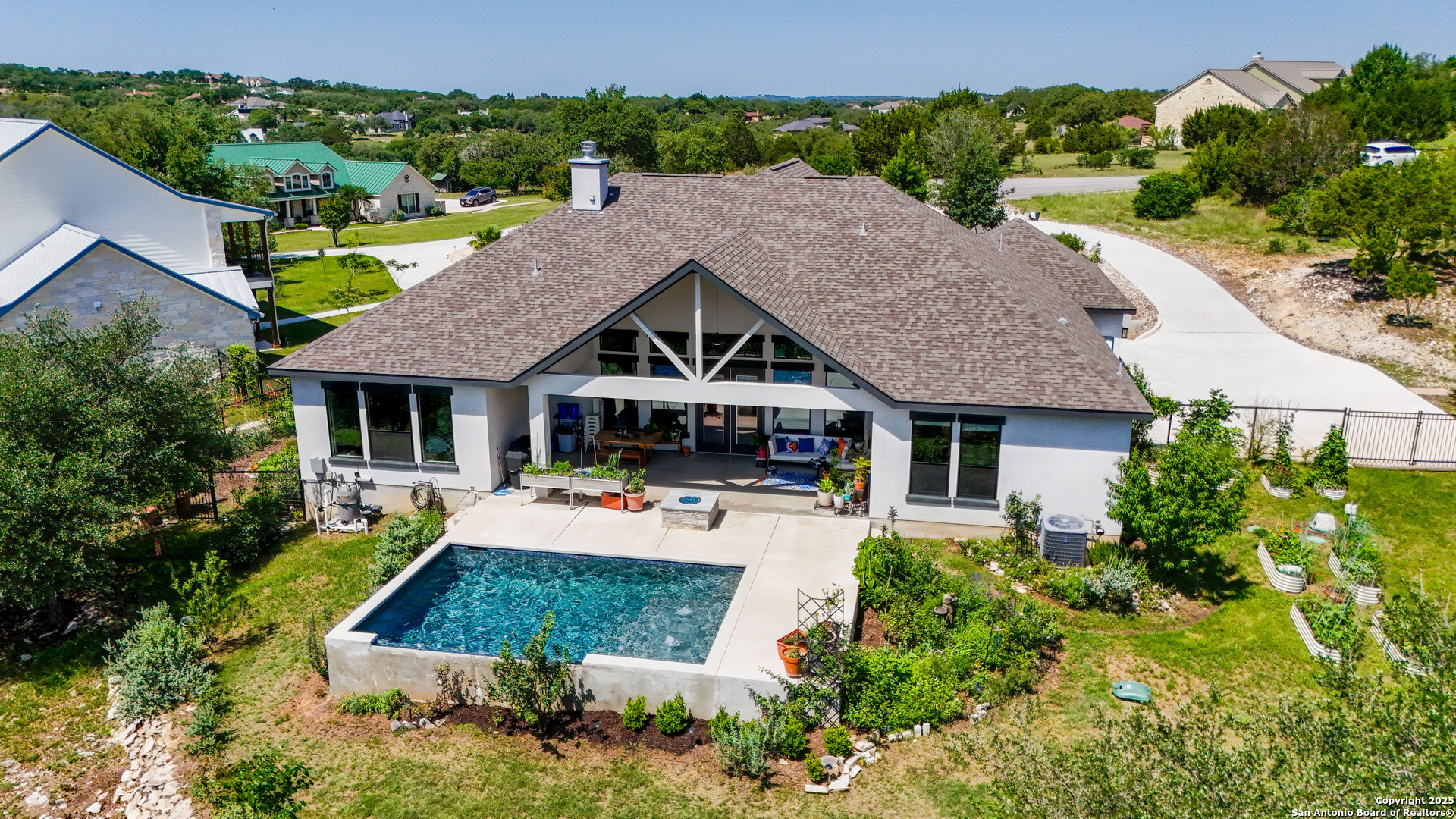 191 Crane Circle Spring Branch, TX 78070 - Photo 40 of 57 an aerial view of a house with swimming pool patio and outdoor seating