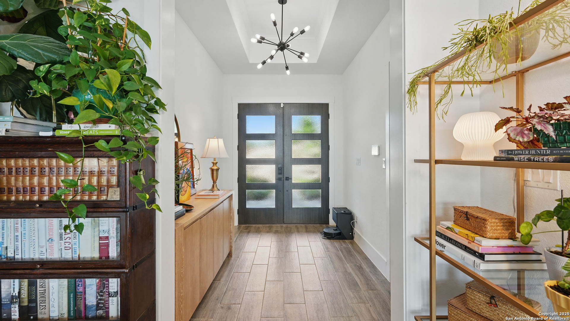 191 Crane Circle Spring Branch, TX 78070 - Photo 9 of 59 a view of a hallway with wooden floor and staircase
