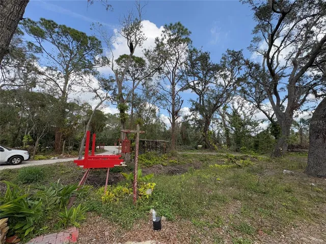 a view of a swimming pool with outdoor seating