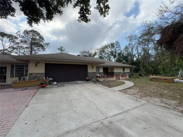 a living room with fireplace furniture and a flat screen tv