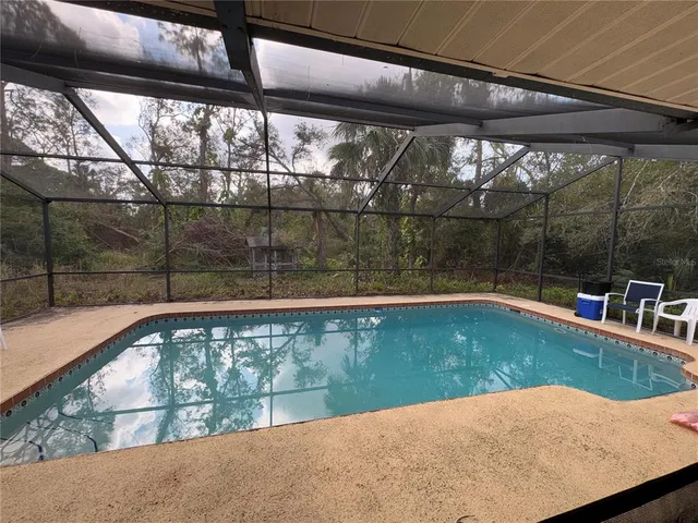 a living room with patio furniture and a window