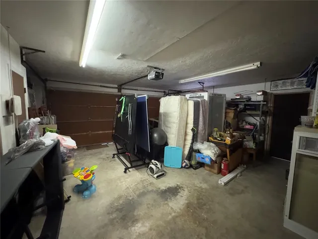 a bathroom with a sink mirror vanity and toilet