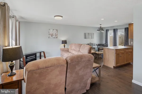 a bedroom with furniture and wooden floor